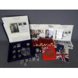 A coin case and contents with commemorative coins,