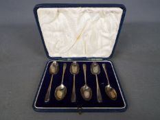 A cased set of six George V hallmarked silver teaspoons, London assay 1934.