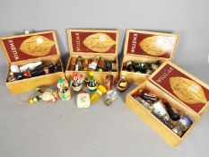 A collection of various miniature / taster bottles of alcoholic drink to include whisky, gin,