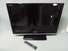 A Toshiba Regza 32" LCD colour TV with remote.