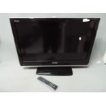 A Toshiba Regza 32" LCD colour TV with remote.