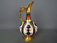 Royal Crown Derby - A Royal Crown Derby 1128 pattern Imari, swan neck ewer,