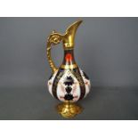 Royal Crown Derby - A Royal Crown Derby 1128 pattern Imari, swan neck ewer,