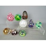 Paperweights - a collection of glass paperweights to include two Mdina, four Caithness,