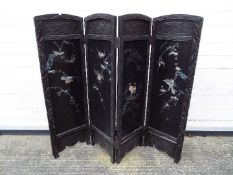 A small four fold room divider or fire screen with inlaid decoration, approximately 90 cm x 108 cm.