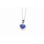 9 carat white gold, sapphire and diamond pendant.