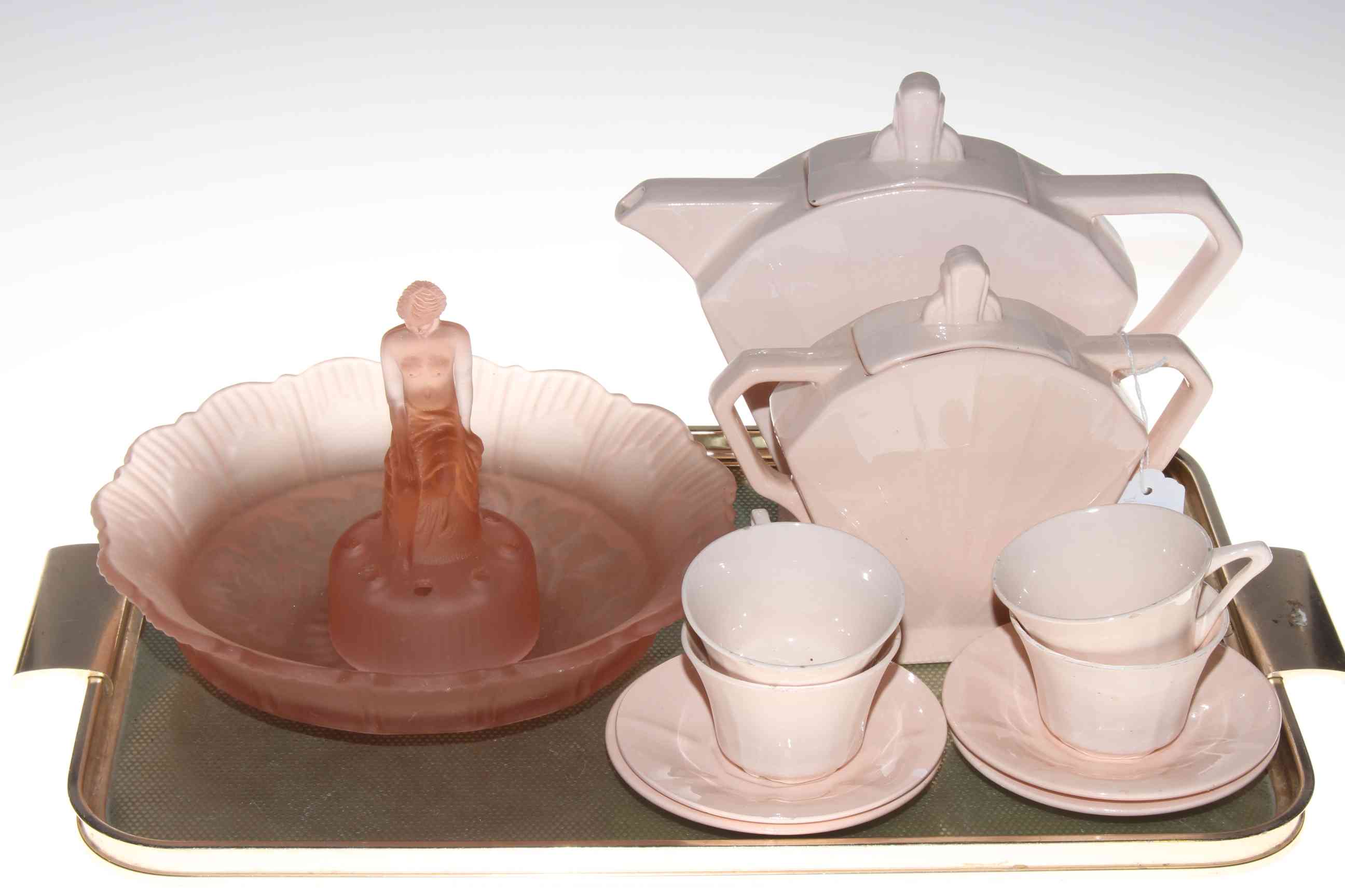 Art Deco ten piece part tea service and Sowerby pink glass seated lady in bowl.