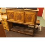 Carved oak three door potboard side cabinet.