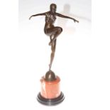 Bronze lady in a dancing pose on a marble plinth, 56cm.