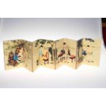 Chinese fold out book of erotic images on silk, 10cm by 12cm.