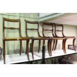 Set of four William IV mahogany sabre leg dining chairs.