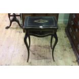 Victorian ebonised and inlaid work table on cabriole legs.