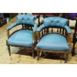 Two similar late Victorian walnut tub chairs.