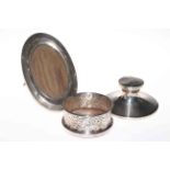 Silver capstan inkwell, silver photograph frame and plated bottle coaster (3).
