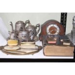 Silver plated teapots, jug and server, mantel clock, bibles and a tapestry vanity set.