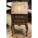 Neat mahogany crossbanded two drawer bureau on cabriole legs, 100cm by 46cm.