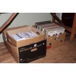 Three boxes of LP records, singles and cassette tapes.