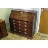 Georgian mahogany four drawer bureau on ogee bracket feet, 101cm by 102cm.