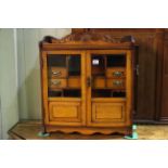 Early 20th Century oak double glazed panel door smokers cabinet, 62cm by 54.5cm.