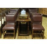 Set of eight oak and studded hide dining chairs including pair carvers.