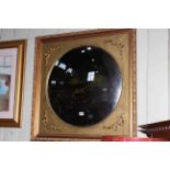 Circular convex mirror in square gilt frame, 80cm by 80cm overall.