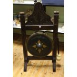 Victorian carved oak and beaten metal dinner gong and beater, 121cm by 60cm.