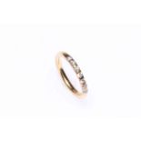 18 carat gold and diamond set half eternity ring.