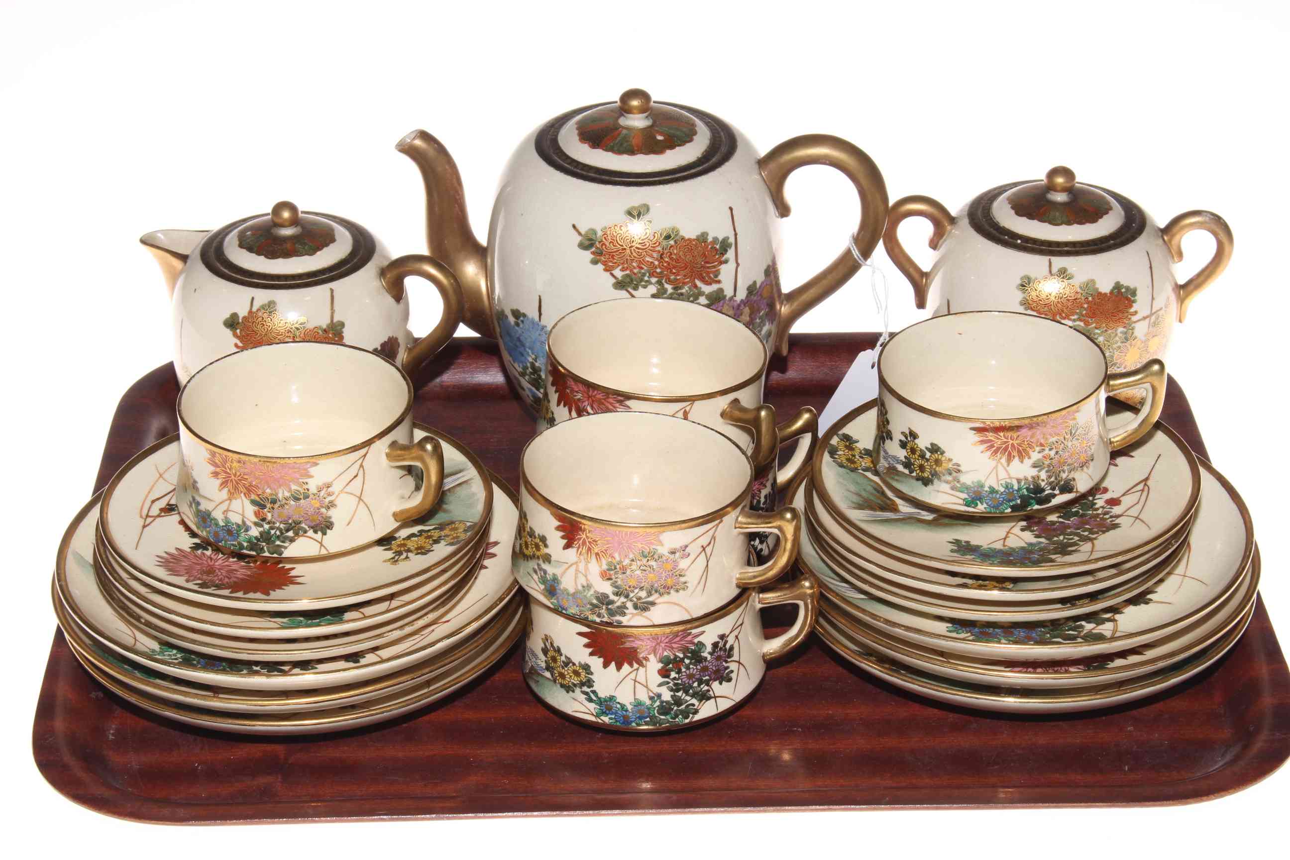 Twenty one piece Satsuma tea set with floral design.