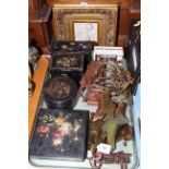 Black lacquered and mother of pearl tea caddy and three similar boxes, gilt framed cherub plaque,