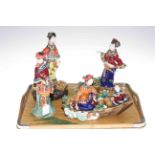 Collection of four Oriental figures.