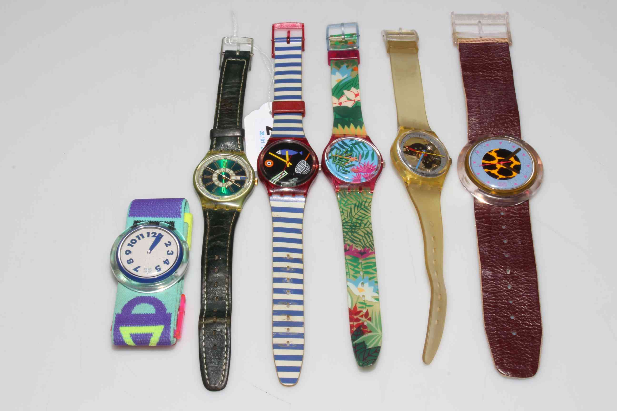 Six mostly Swatch watches.