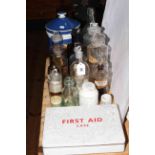 Collection of chemist bottles, jars and first aid case.