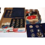 Box of assorted worldwide coins, gold plated and commemorative coins.