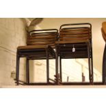 Set of seven slatted stacking chairs.