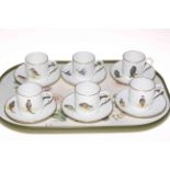 Set of six Royal Worcester coffee cans and saucers decorated with birds.