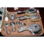 Silver backed brushes and mirrors, three silver salts, scent bottle, caddy spoon, etc.