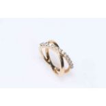 Diamond set yellow gold double crossover ring, size N.