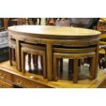 Oval Chinese hardwood nest of seven tables.