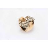 Multi-stone diamond cluster ring set in 18 carat gold.