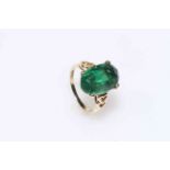 9 carat gold ring with large treated green sapphire, size M.