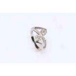 14K white gold and diamond set crossover ring, size N.