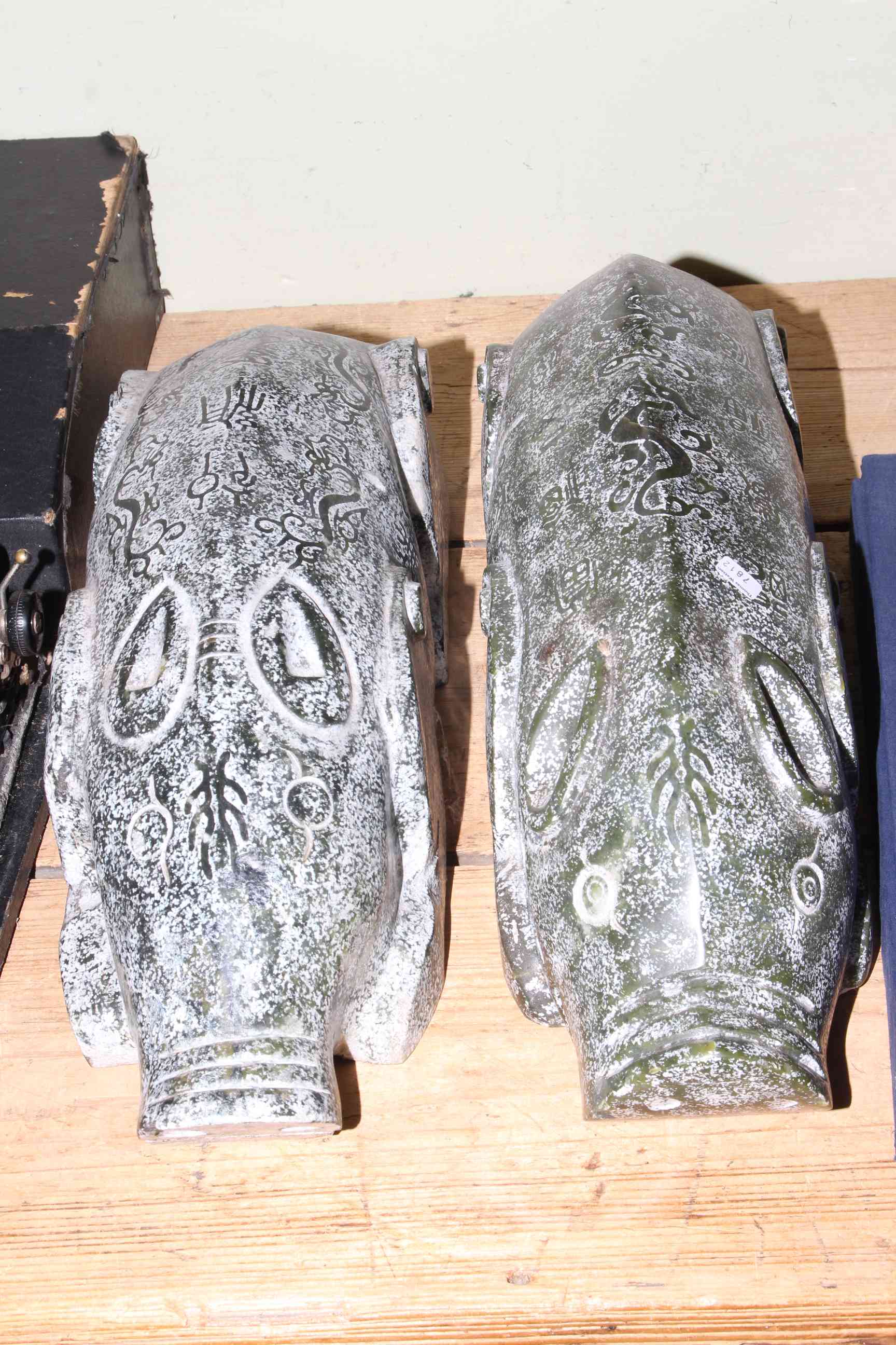 Pair of oriental green polished stone recumbent pigs.