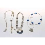 Three Ginny D silver necklaces, with bags.