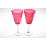 Pair of Victorian cranberry wedding goblets, 28cm.