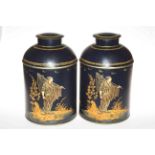 Pair of tin lidded storage containers decorated with Oriental fishermen.