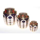 Set of three graduated Royal Crown Derby Imari Pattern lidded jars, 1128.