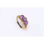 9 carat gold amethyst three stone ring.