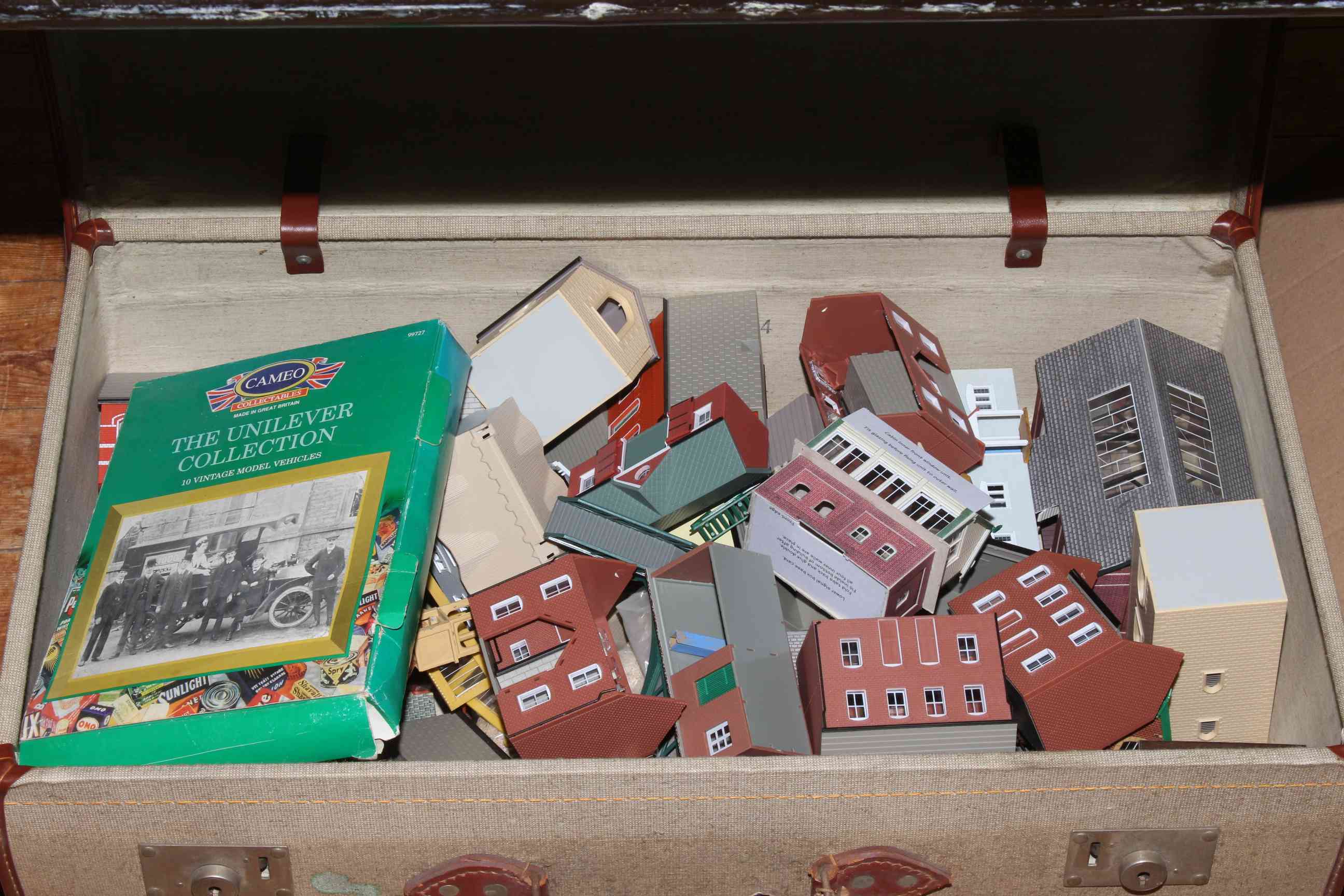 Suitcase of model railway buildings and accessories.