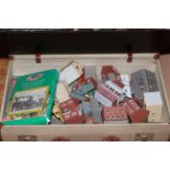 Suitcase of model railway buildings and accessories.