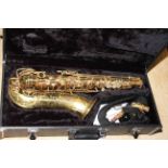 Cased saxophone.